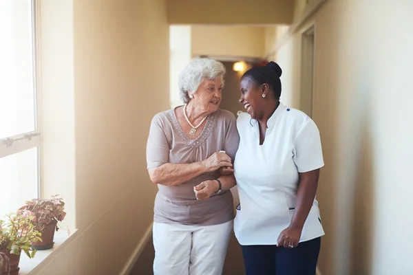 caregiver laughing with elder client