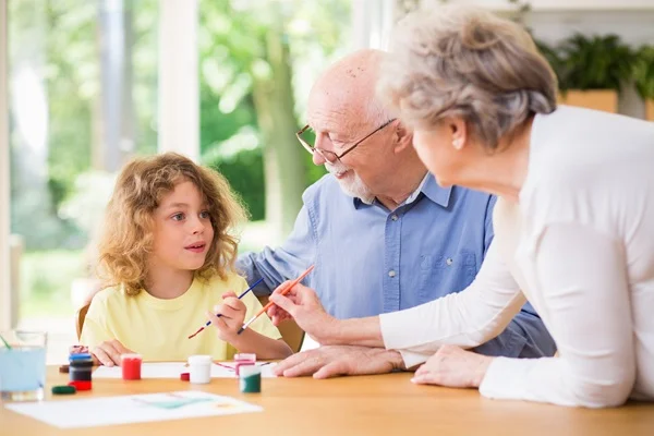 grandparents playing with grandkid