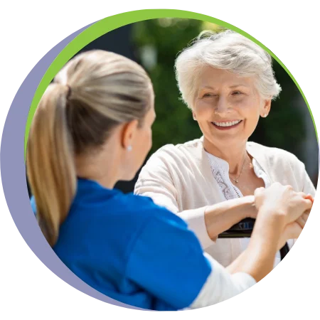 caregiver with senior woman outside