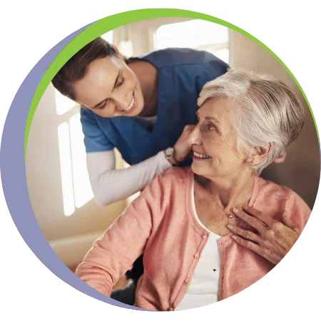 caregiver and elder lady smiling