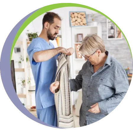 caregiver helping senior with dressing