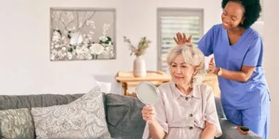 caregiver helping an alzheimers patient