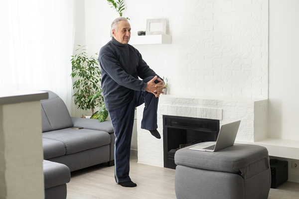 elderly man doing a chair exercise