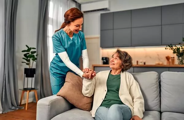 senior woman with caregiver in home