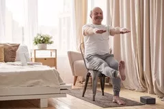 Senior man working out chair exercise