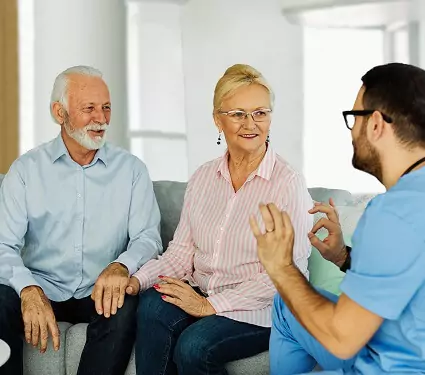 certifiec nurse explaining care options to seniors