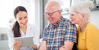 caregiver with senior couple