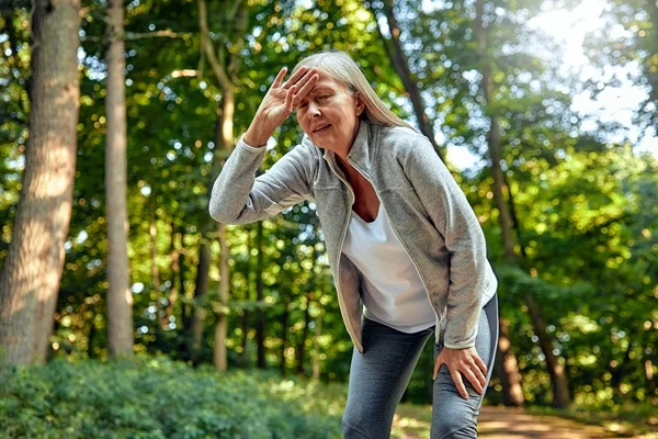 senior woman experiencing heat exhaustion