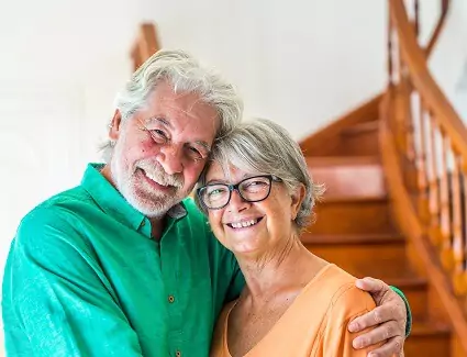 smiling senior couple at home